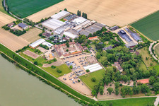 Oblique view of Intersnack Deutschland SE plant in Petersau on the banks of the Rhine and Carlo von Opel riding school at the Demeter Hofgut Petersau in the district Mörsch in Frankenthal in the state Rhineland-Palatinate, Germany