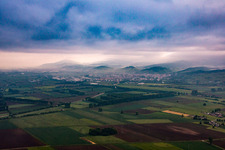 Mountains on the edge of the Odenwald in morning mist in Heppenheim in the state Hesse, Germany