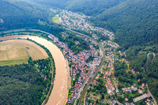 Village view on the banks of the Neckar with Vorderburg and Mittelburg in Neckarsteinach in the state Hesse, Germany