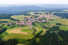 Village - view on the edge of agricultural fields and farmland in Rothenberg in the state Hesse, Germany