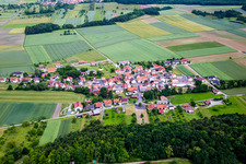 Village - view on the edge of agricultural fields and farmland in Theinfeld in the state Bavaria, Germany