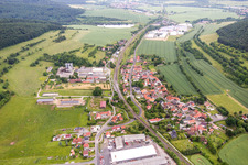 Village - view on the edge of agricultural fields and farmland in Ritschenhausen in the state Thuringia, Germany
