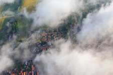 Aerial view of Wolfgangsgang Church under clouds in Freckenfeld in the state Rhineland-Palatinate, Germany