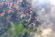 Protestant and Catholic Church under clouds in Minfeld in the state Rhineland-Palatinate, Germany