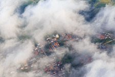 Aerial view of Primary school and Mundohalle under clouds in Minfeld in the state Rhineland-Palatinate, Germany
