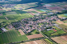 Village - view on the edge of agricultural fields and farmland in Weingarten (Pfalz) in the state Rhineland-Palatinate, Germany