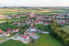 Village - view on the edge of agricultural fields and farmland in Oberpoering in the state Bavaria, Germany