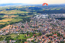 Aerial view of Paraglider over the city from the northeast in Lorsch in the state Hesse, Germany
