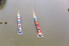 Container ships overtake each other on the Rhine in the district Ibersheim in Worms in the state Rhineland-Palatinate, Germany