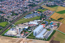 Aerial view of Am Kreuz industrial park with TST GmbH, Baumit GmbH - location Biblis / Hahnstätten and Freotec external warehouse in Biblis in the state Hesse, Germany