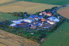 Aerial view of Small area at the airfield with motorcycle and technology museum and Agrinova GmbH in Quirnheim in the state Rhineland-Palatinate, Germany