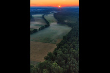 Sunrise in the Otterbachtal with morning mist in Kandel in the state Rhineland-Palatinate, Germany out of the air