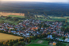 Village view in the morning from the north with Catholic Church of St. Leodegar in Steinfeld in the state Rhineland-Palatinate, Germany