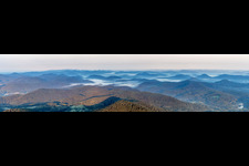 Panoramic perspective of Forest and mountain scenery of the Pfaelzerwald with valleys in morning mist in Dahn in the state Rhineland-Palatinate, Germany
