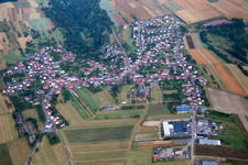 Aerial view of Village - view on the edge of agricultural fields and farmland in Donsieders in the state Rhineland-Palatinate