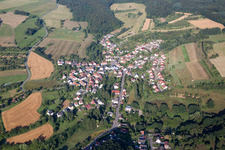 Village - view on the edge of agricultural fields and farmland in Frohnhofen in the state Rhineland-Palatinate, Germany