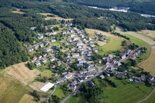 Village - view on the edge of agricultural fields and farmland in Hattgenstein in the state Rhineland-Palatinate, Germany