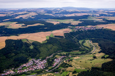 Village - view on the edge of agricultural fields and farmland in Heinzenhausen in the state Rhineland-Palatinate, Germany