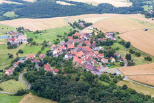 Village - view on the edge of agricultural fields and farmland in Seelen in the state Rhineland-Palatinate, Germany