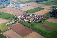 Village - view on the edge of agricultural fields and farmland in Reinersdorf in the state Bavaria, Germany