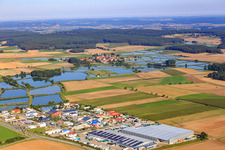 Industrial area East with Ludwig Peetz, Spedition und Lagerung GmbH & Co. KG in front of the Franconian pond landscape in Weisendorf in the state Bavaria, Germany