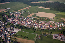 Aerial photograpy of Village - view on the edge of agricultural fields and farmland in Herbsheim in Grand Est, France