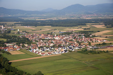 Aerial view of Village on the river bank areas of the river Ill in Sermersheim in Grand Est, France