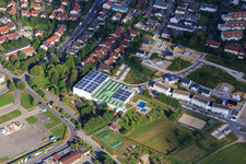 Aerial view of Walzbachbad indoor and outdoor pool and terraced houses on Walzbachweg in Weingarten in the state Baden-Wuerttemberg, Germany