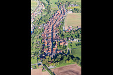 Aerial view of Village - view on the edge of agricultural fields and farmland in Schuetzingen in the state Baden-Wurttemberg, Germany