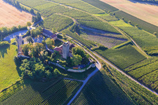 Bird's eye view of Ravensburg Castle (Sulzfeld) in the morning on a hill with vineyards in Sulzfeld in the state Baden-Wuerttemberg, Germany