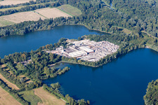 Aerial view of Mixed concrete and building materials factory of Lithonplus GmbH & Co. KG on lake Fuchs & Gros in Eggenstein-Leopoldshafen in the state Baden-Wurttemberg, Germany