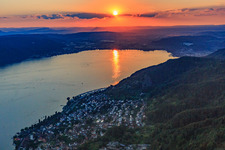 Aerial photograpy of Sunset over Lake Überlingen with paraglider in Bodman-Ludwigshafen in the state Baden-Wuerttemberg, Germany