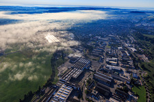 Schwarzachstraße industrial area with KNOLL Maschinenbau GmbH under low clouds in Bad Saulgau in the state Baden-Wuerttemberg, Germany