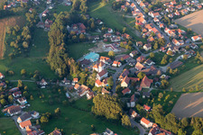 Oblique view of Village - view on the edge of agricultural fields and farmland in Herdwangen-Schoenach in the state Baden-Wurttemberg, Germany