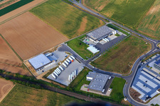 Aerial view of Industrial area in the Speyer Valley with Resinnovation GmbH, Markthalle 5, and TRANSAC International Shipping Company Ltd. in Rülzheim in the state Rhineland-Palatinate, Germany
