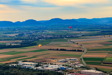 2 hot air balloons towards Insheim in Herxheim bei Landau in the state Rhineland-Palatinate, Germany