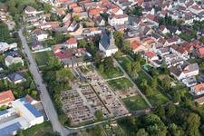 Grave rows on the grounds of the cemetery near the church in Gross-Rohrheim in the state Hesse, Germany