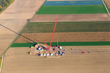 Oblique view of Construction site at the wind turbine foundation with crane in the wind farm Hatzenbühl in Hatzenbühl in the state Rhineland-Palatinate, Germany