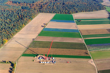 Construction site at the wind turbine foundation with crane in the wind farm Hatzenbühl in Hatzenbühl in the state Rhineland-Palatinate, Germany from above