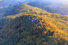Madenburg castle ruins in the autumn forest at evening light in Eschbach in the state Rhineland-Palatinate, Germany