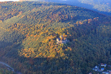 Bird's eye view of Castle ruins of Landeck Castle in the autumn forest at evening light in Klingenmünster in the state Rhineland-Palatinate, Germany
