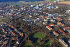 Aerial view of Rathausstraße with modern architecture of the parish church Heilig Geist and city park from the southeast in Bad Füssing in the state Bavaria, Germany