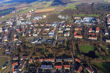 Aerial photograpy of Rathausstraße with modern architecture of the parish church Heilig Geist and city park from the southeast in Bad Füssing in the state Bavaria, Germany