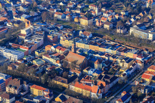Town houses on the town square and parish church of St. Simon and Judas from the southeast in Pfarrkirchen in the state Bavaria, Germany