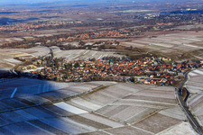 Village view below the small Kalmit in winter with snow from the southwest in Ilbesheim bei Landau in the state Rhineland-Palatinate, Germany
