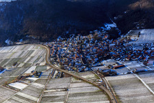 Village view in winter with snow from the east in Eschbach in the state Rhineland-Palatinate, Germany