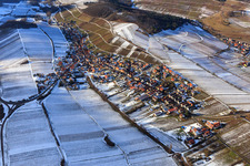 Aerial view of View of the winegrowing village in winter with snow-covered vineyards from the east in Ranschbach in the state Rhineland-Palatinate, Germany