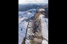 Aerial view of Wintry snowy Village - view on the edge of snowed wine yards in Ranschbach in the state Rhineland-Palatinate, Germany