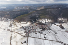 Wintry snowy Village - view on the edge of agricultural fields and farmland in Gleisweiler in the state Rhineland-Palatinate, Germany