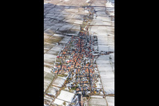 Wintry snowy Village - view on the edge of agricultural fields and farmland in Roschbach in the state Rhineland-Palatinate, Germany